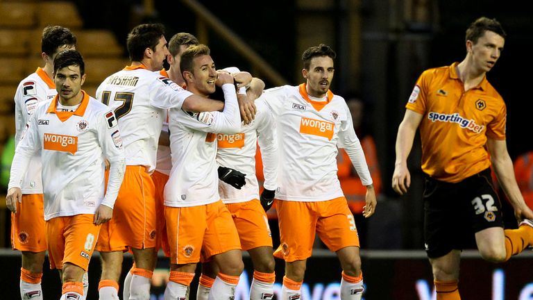 Tom Ince: Mobbed after brilliant two-goal display earned Blackpool victory