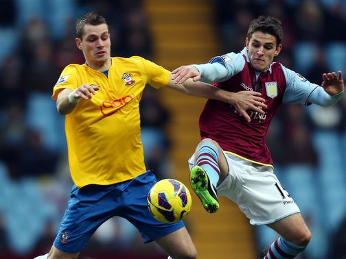 Mogan Schneiderlin and Ashley Westwood battle for possession