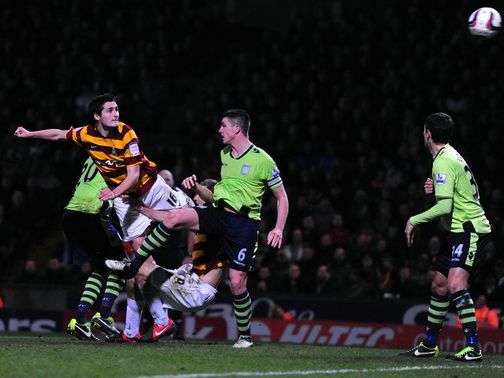Carl McHugh heads home Bradford's third goal