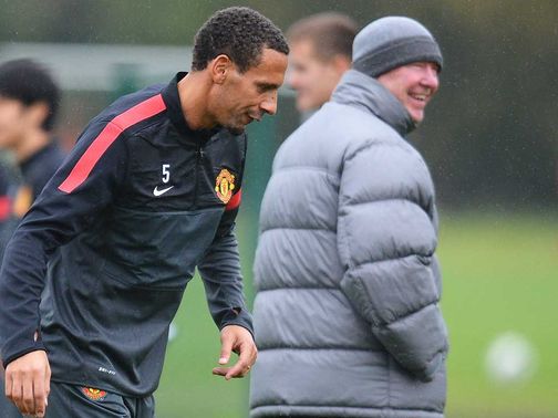 Ferdinand (left) and Ferguson: Boss 'not panicking'