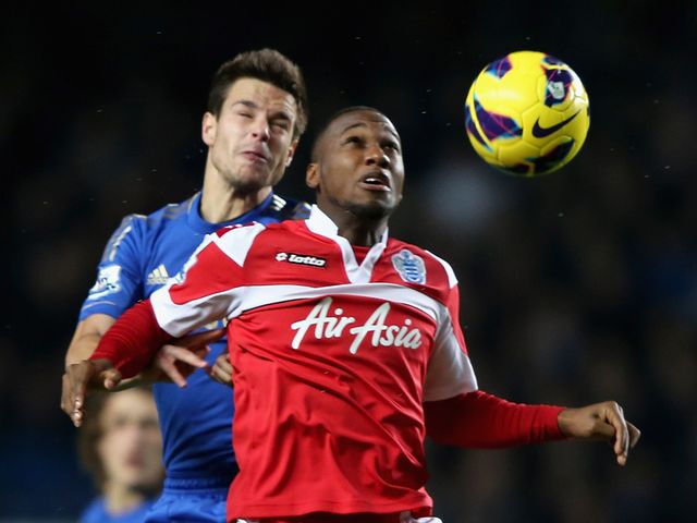 Cesar Azpilicueta and Junior Hoilett in aerial battle