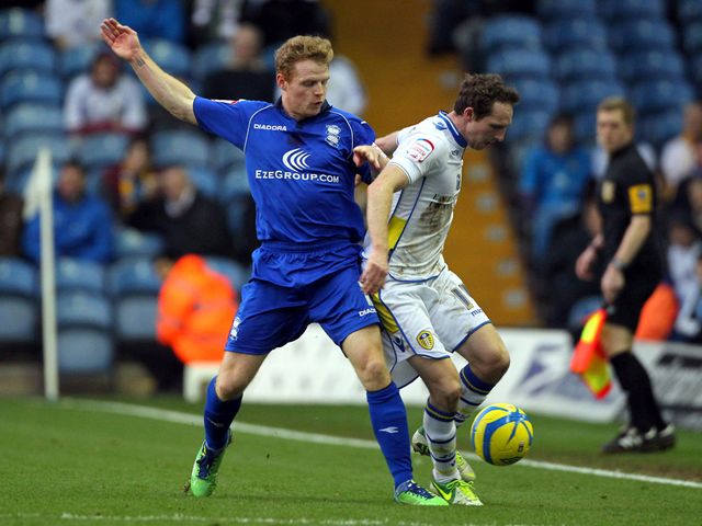 Chris Burke and Aidan White battle for the ball