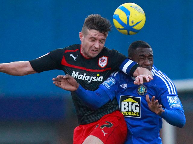 Stephen McPhail and Amari Morgan Smith go for a header