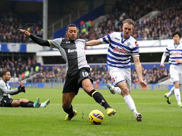 Mousa Dembele and Clint Hill battle for the ball