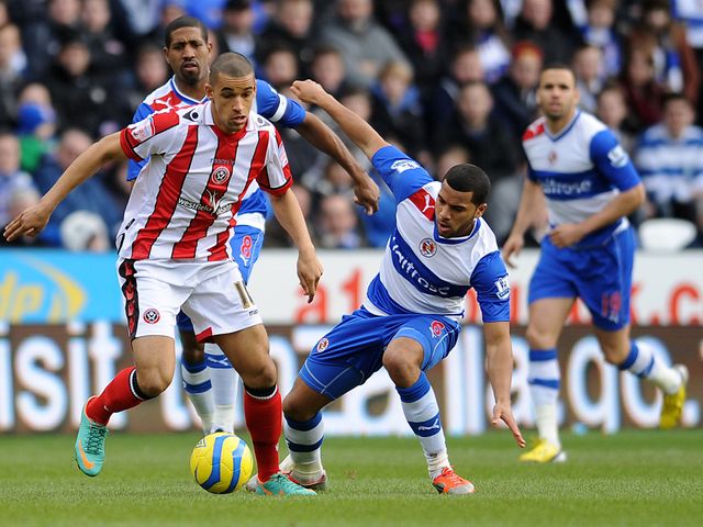 Neil Blackman is tackled by Adrian Mariappa