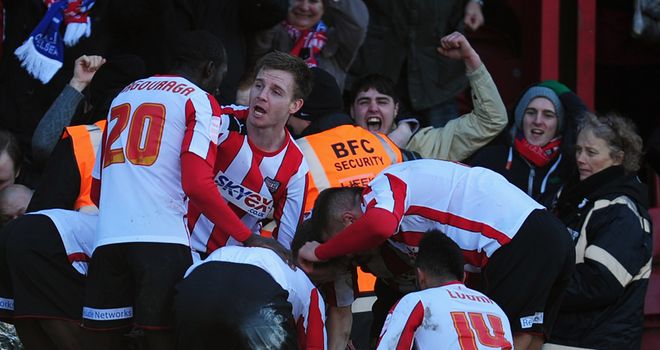 Brentford's players celebrate scoring against Chelsea