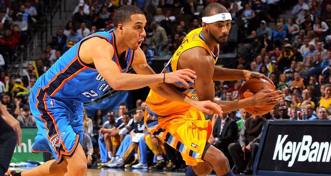 Kevin Martin and Corey Brewer in action
