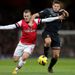 Jack Wilshere and Steven Gerrard battle for possession