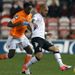 Askan Dejegah competes with Isaiah Osbourne at a freezing Bloomfield Road on the coast