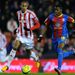 Crystal Palace star Wilfred Zaha battles with Steven Nzonzi at the Britannia Stadium