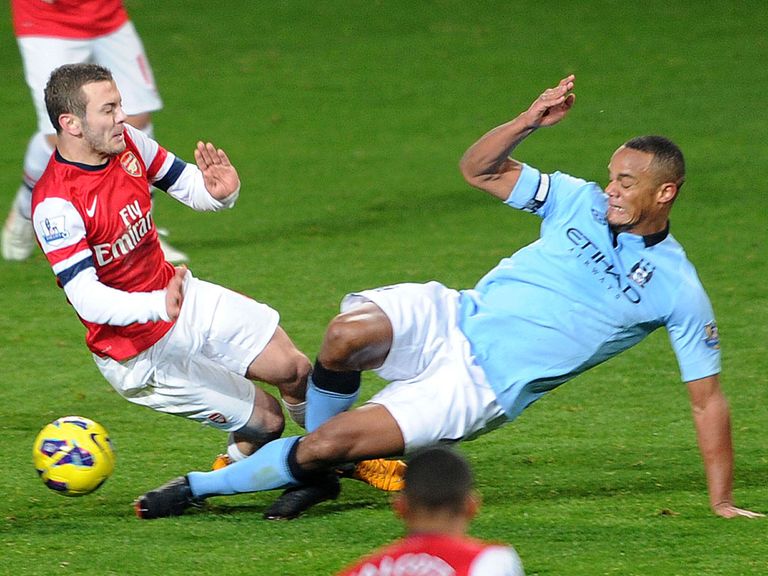 Kompany saw red for this challenge on Wilshere