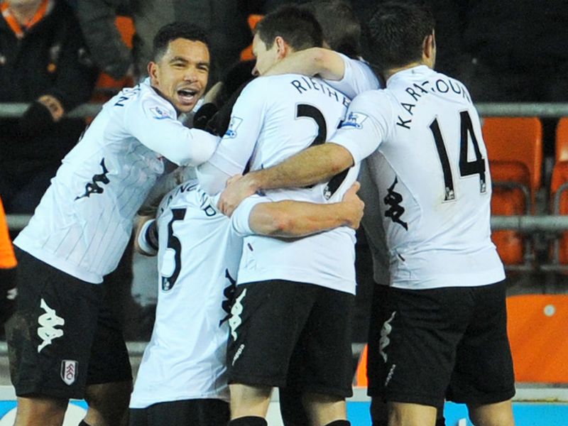 Fulham defender Brede Hangeland is somewhere in the crowd as teammates celebrate his winning goal at Blackpool