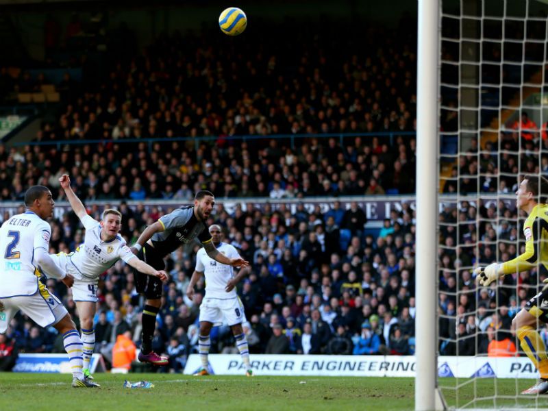 Renewed hope: Clint Dempsey rises above Tom Lees to head Spurs' opening goal