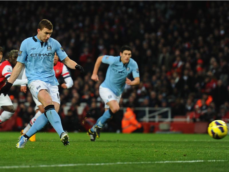 ...Edin Dzeko takes the resulting penalty...
