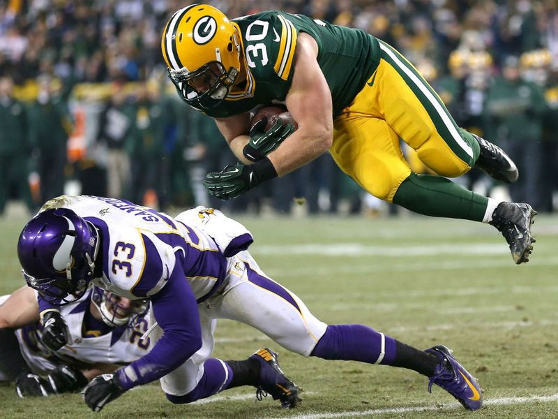 John Kuhn goes in for a touchdown on the ground - he also caught a scoring pass for Green Bay...