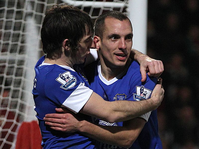 Two of Everton's goalscorers - Leighton Baines and Leon Osman - celebrate at the Abbey Business Stadium
