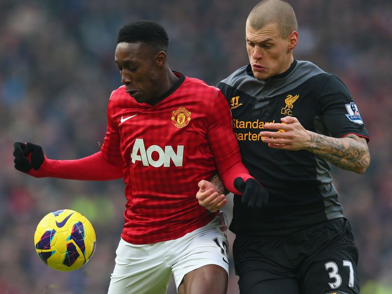 Fully focused: Martin Skrtel and Danny Welbeck watch the ball