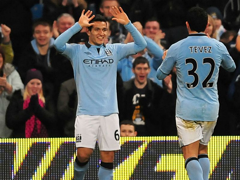 Seventeen year old Marcos Lopes grabs a goal three minutes into his Manchester City debut, adding to goals from Tevez and Barry to beat Watford 3-0.