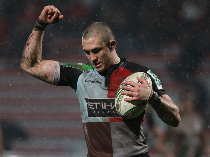 Mike Brown: Celebrates after Harlequins beat Biarritz 16-9 in sodden conditions in south-west France to maintain their perfect record in Pool 3.