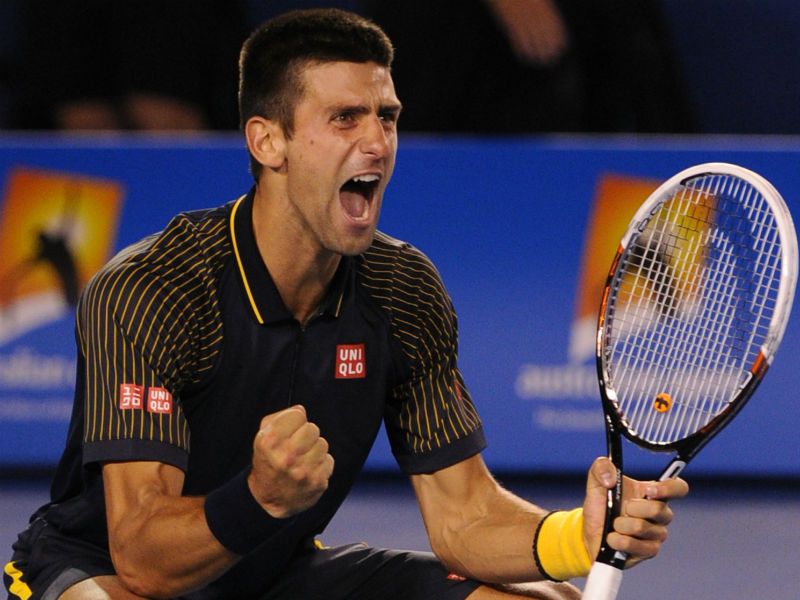 History maker: Djokovic celebrates winning his third successive Australian Open men's title, the first player to do so in the Open era...
