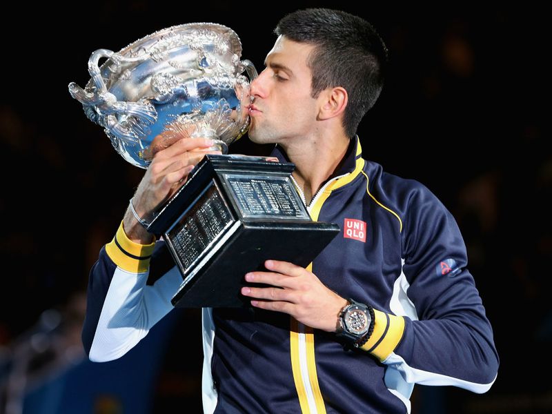 Well-earned success: Djokovic kisses the trophy after his victory