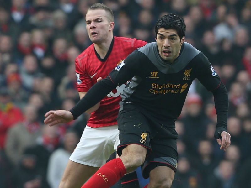 Early action: Tom Cleverley and Luis Suarez vie for the ball