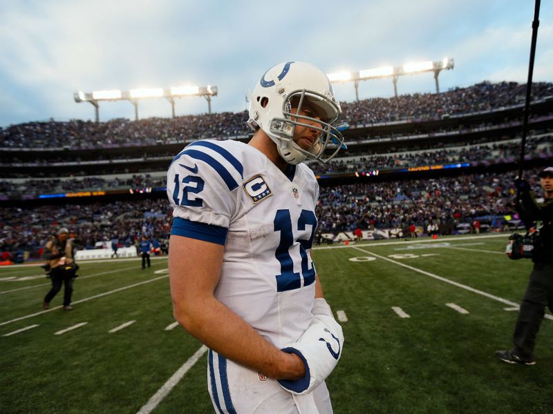 Colts quarterback Andrew Luck cuts a dejected figure as he trudges from the field after his side's loss.