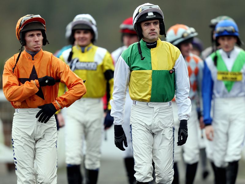 The jockeys emerge for the opener...