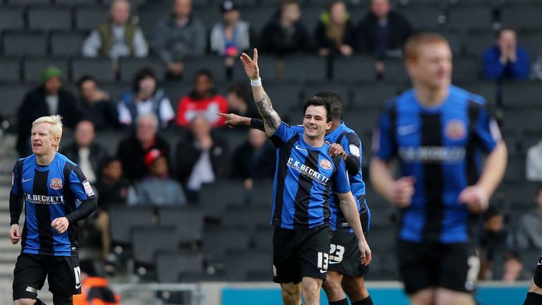 Chris Dagnall: Celebrates after opening the scoring for Barnsley at MK Dons