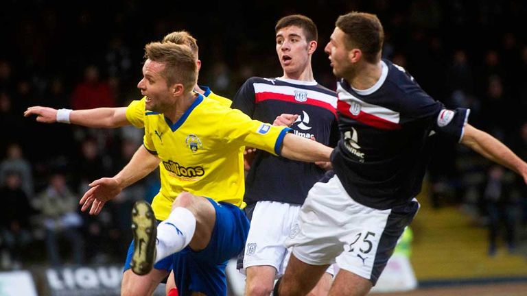 Dundee's Lewis Toshney (far right) scores against Morton