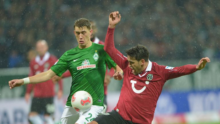 Nils Petersen (left) challenges for the ball
