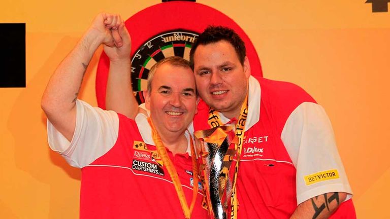 On top of the world: Adrian Lewis and Phil Taylor are looking to lift the World Cup of Darts again this weekend