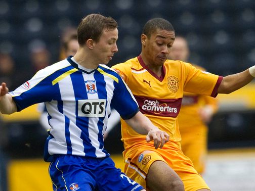 Jeroen Tesselaar and Chris Humphrey battle for the ball