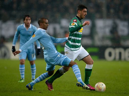 Abdoulay Konko tries to tackle Tolga Cigerci