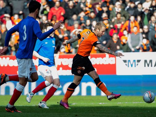 Johnny Russell puts Dundee United 1-0 up.
