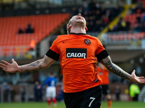 Johnny Russell celebrates as Dundee United beat Rangers.