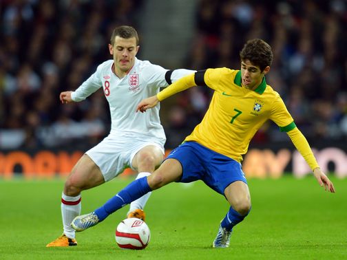 Wilshere (left) believes he can handle the pressure