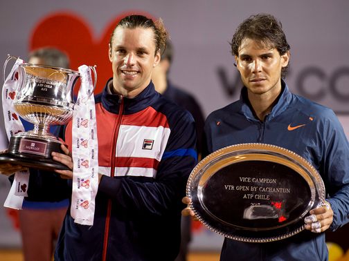 Zeballos poses with the winner's trophy