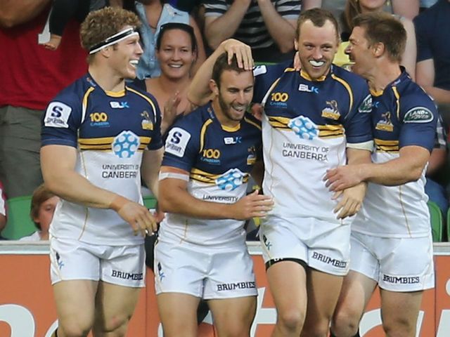 Mogg celebrates his try for the Brumbies