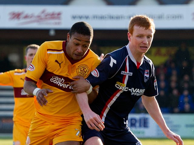 Chris Humphrey and Scott Boyd battle for the ball