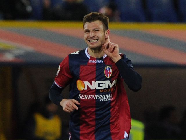 Marco Motta celebrates his goal for Bologna