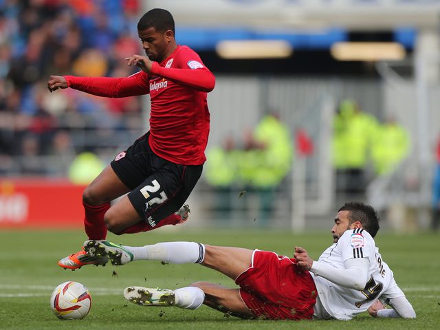 Frazier Campbell is tackled by Liam Fontaine.
