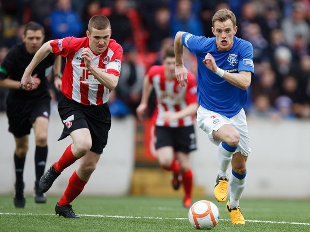 Dean Shiels gets away from John Sweeney.
