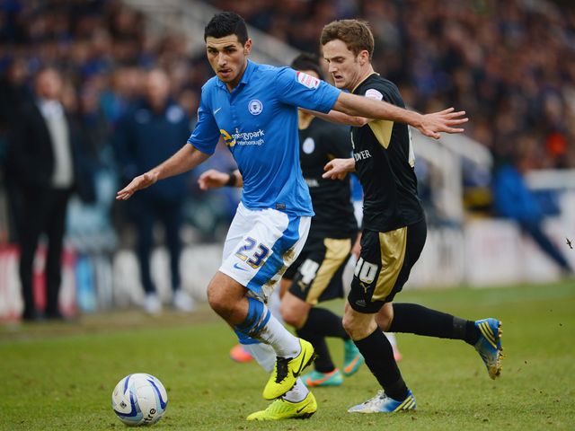 Davide Petrucci tries to hold off Leicester's Andy King