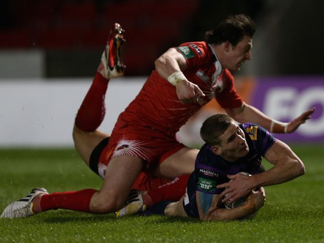 Sam Tomkins touches down for the first of his three tries