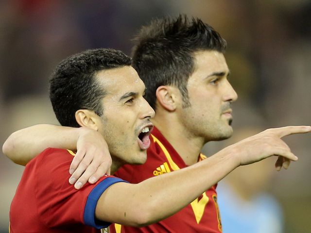 Pedro Rodriguez and David Villa celebrate for Spain