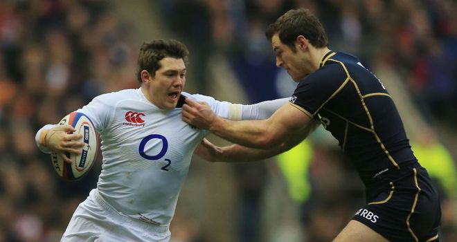 England's Alex Goode hands off Scotland wing Tim Visser