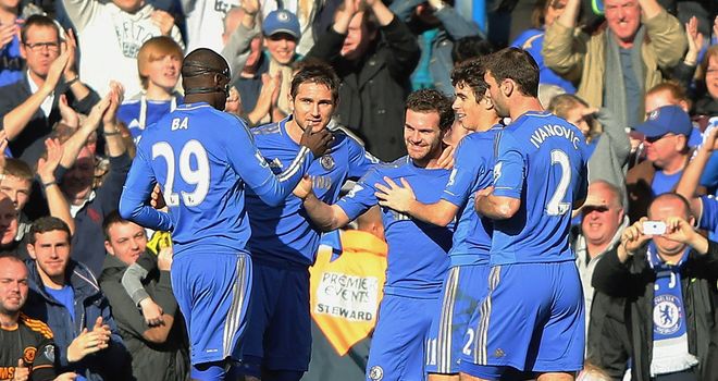 Juan Mata: Celebrates after opening the scoring at Stamford Bridge