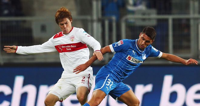Gotoku Sakai and Vincenzo Grifo battle for possession