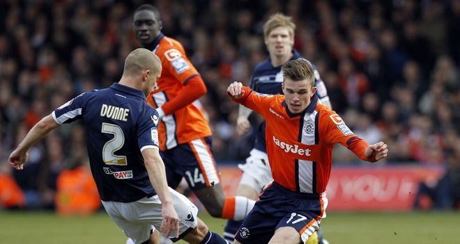 Alan Dunne (left) admits Millwall's mind has been on the FA Cup